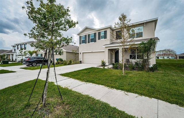 view of front of home featuring a front yard and a garage