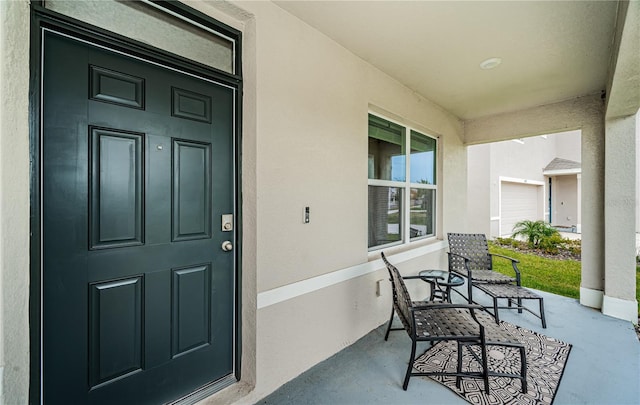 doorway to property featuring a garage