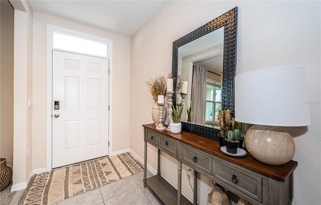 8367 Ender Hills Dr, Wesley Chapel, FL 33545 - foyer entrance with healthy amount of natural light, light tile patterned floors, and baseboards