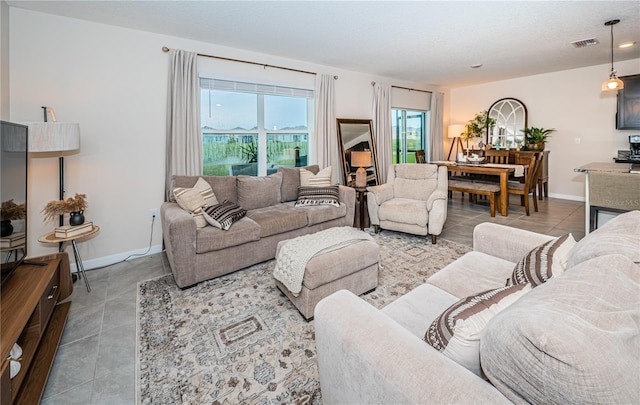 8367 Ender Hills Dr, Wesley Chapel, FL 33545 - living room with tile patterned floors and baseboards