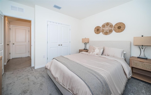 carpeted bedroom featuring a closet