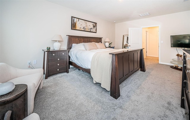 bedroom featuring light colored carpet