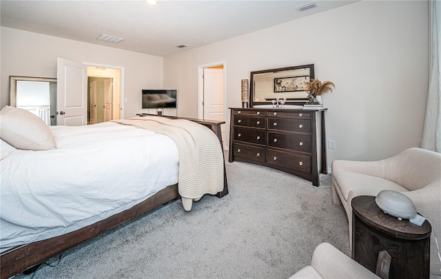 carpeted bedroom featuring a textured ceiling