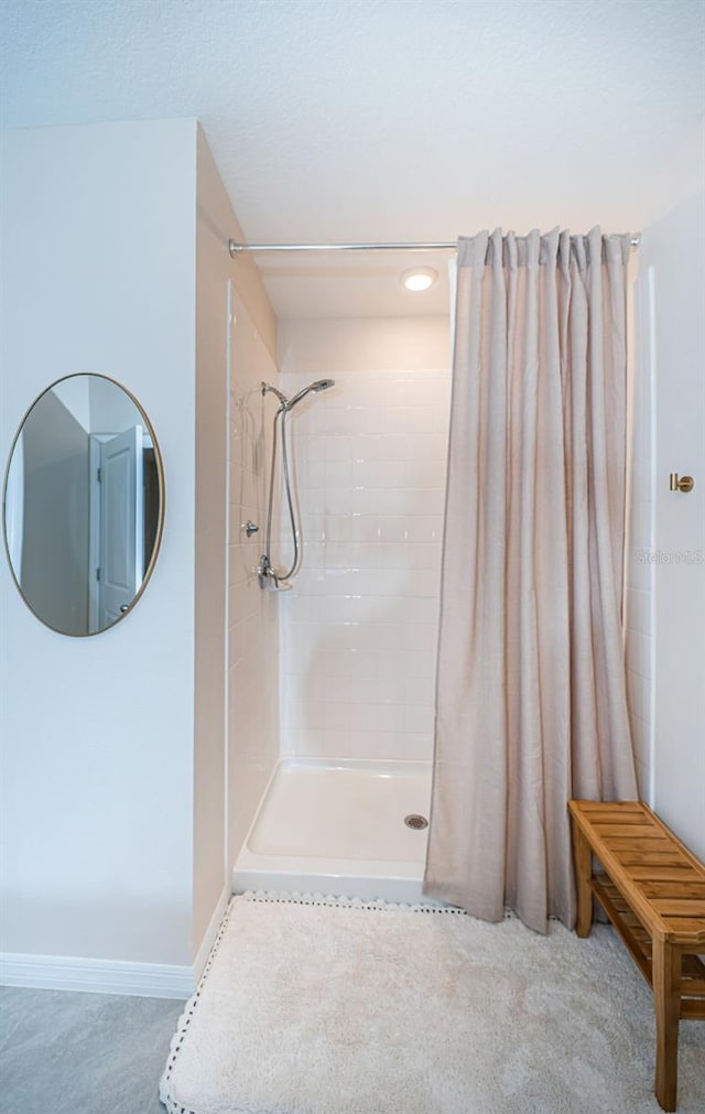 bathroom featuring a shower with curtain