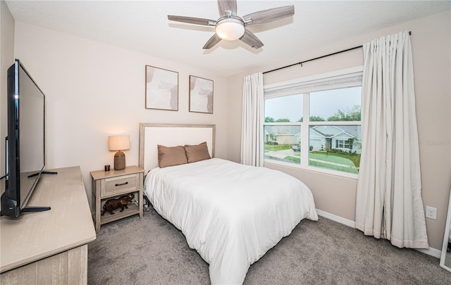 carpeted bedroom with ceiling fan