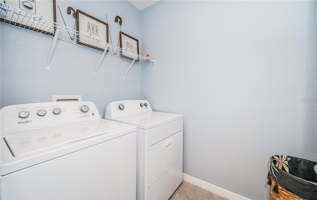 clothes washing area featuring washing machine and dryer