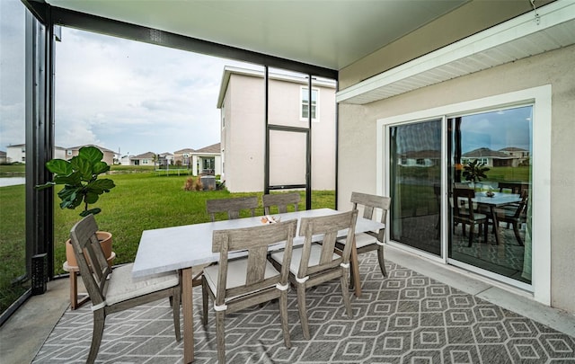 8367 Ender Hills Dr, Wesley Chapel, FL 33545 - sunroom / solarium featuring outdoor dining area, healthy amount of natural light, and a residential view