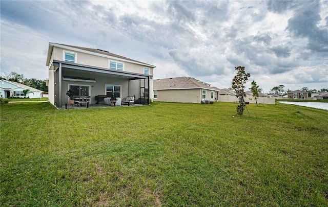 back of property featuring an outdoor hangout area, a yard, and a patio