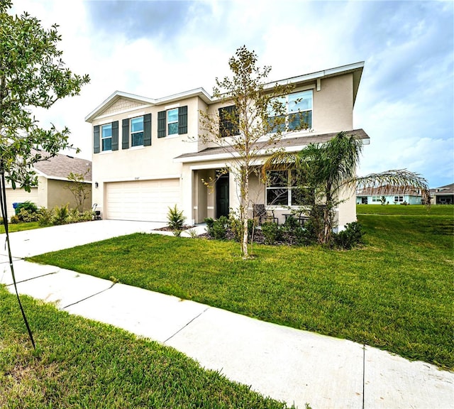 8367 Ender Hills Dr, Wesley Chapel, FL 33545 - view of front of house featuring stucco siding, an attached garage, concrete driveway, and a front lawn