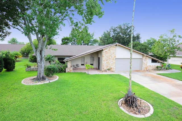 single story home with a garage and a front lawn