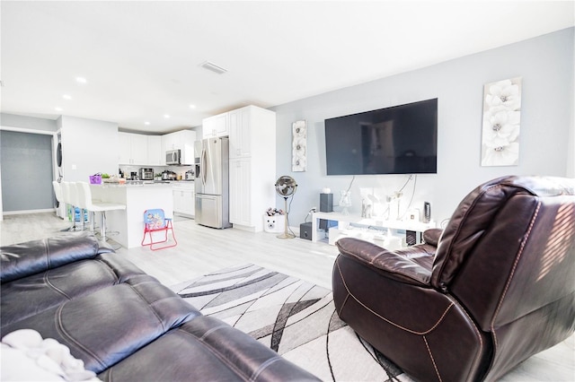 living room featuring light wood-type flooring