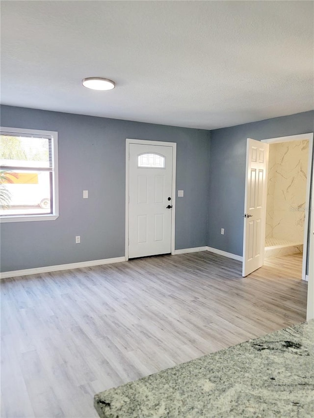 foyer with light wood-type flooring