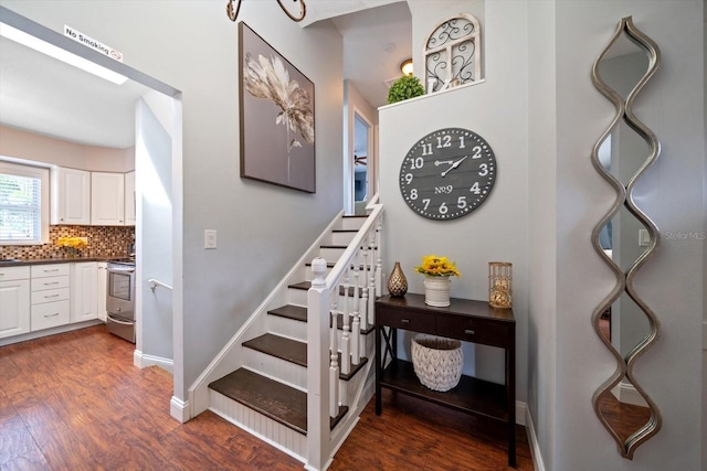 8212 Forest Cir, Seminole, FL 33776 - stairway with wood finished floors and baseboards