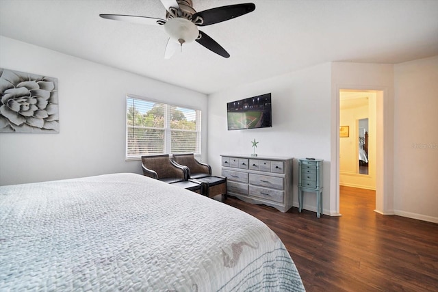 8212 Forest Cir, Seminole, FL 33776 - bedroom with dark wood-style flooring, a ceiling fan, and baseboards