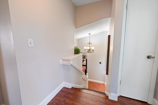 8212 Forest Cir, Seminole, FL 33776 - stairs featuring wood finished floors, a chandelier, and baseboards