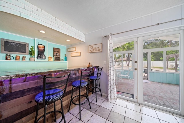 8212 Forest Cir, Seminole, FL 33776 - indoor bar featuring tile patterned flooring and french doors