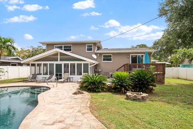 8212 Forest Cir, Seminole, FL 33776 - rear view of house with a sunroom, a deck, and a patio