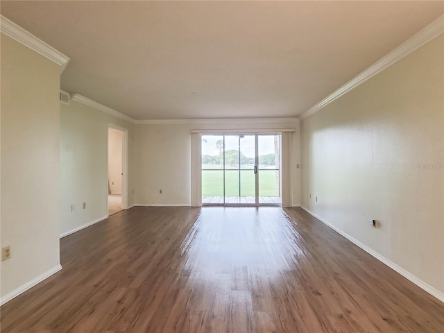 unfurnished room with ornamental molding and dark hardwood / wood-style floors