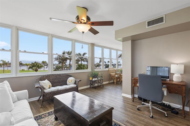 office area featuring ceiling fan and dark hardwood / wood-style flooring