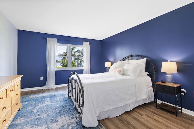 bedroom featuring dark hardwood / wood-style floors