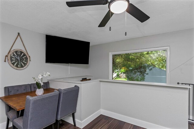 7331/2 New Jersey St, Clearwater, FL 33756 - dining space featuring a textured ceiling, baseboards, dark wood finished floors, and ceiling fan