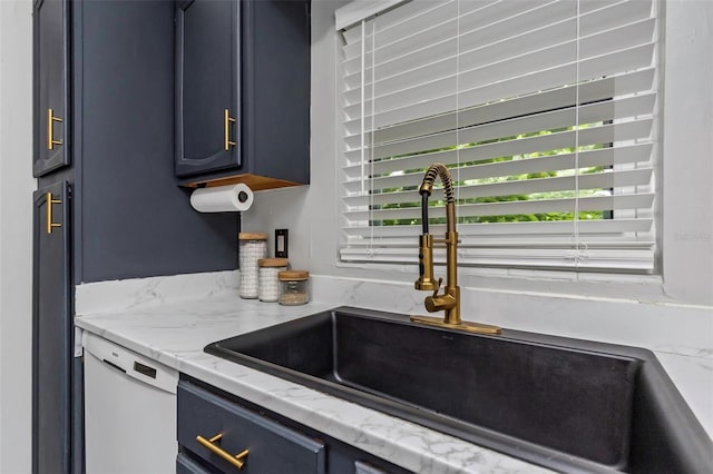 7331/2 New Jersey St, Clearwater, FL 33756 - kitchen featuring light stone countertops, a sink, white dishwasher, and blue cabinetry