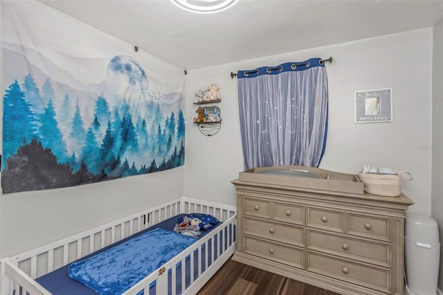 7331/2 New Jersey St, Clearwater, FL 33756 - bedroom featuring dark wood-style flooring