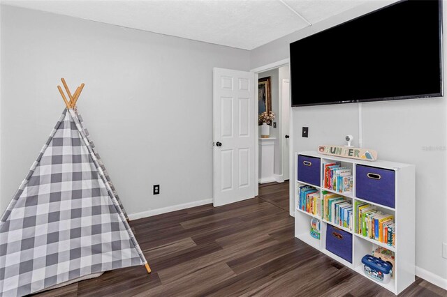 7331/2 New Jersey St, Clearwater, FL 33756 - rec room with baseboards and wood finished floors