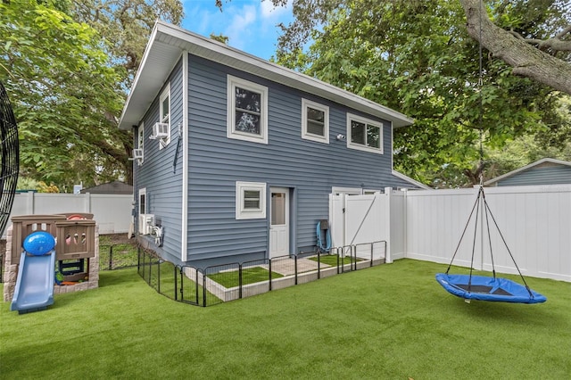 7331/2 New Jersey St, Clearwater, FL 33756 - rear view of property featuring a lawn, a fenced backyard, and cooling unit