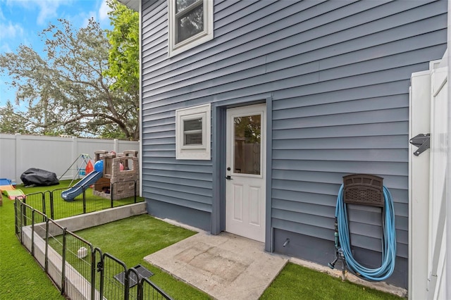 7331/2 New Jersey St, Clearwater, FL 33756 - property entrance with a lawn and fence