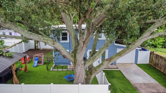 7331/2 New Jersey St, Clearwater, FL 33756 - exterior space with a fenced backyard, a playground, and a front yard