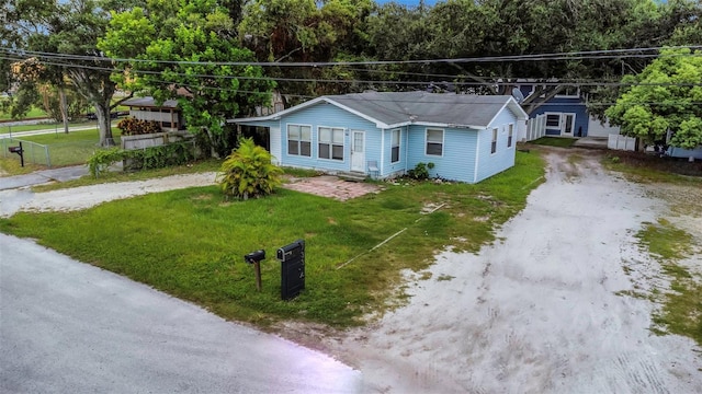 7331/2 New Jersey St, Clearwater, FL 33756 - single story home with dirt driveway and a front lawn