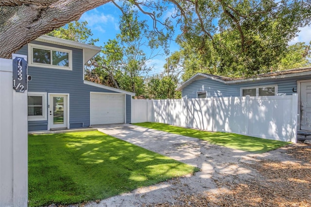 7331/2 New Jersey St, Clearwater, FL 33756 - view of side of home with a yard, fence, and driveway
