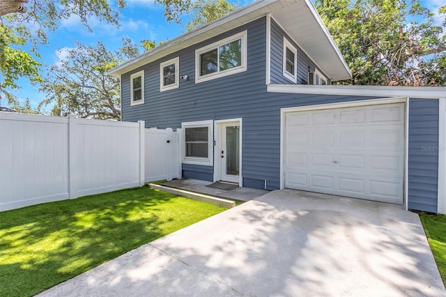 7331/2 New Jersey St, Clearwater, FL 33756 - colonial house featuring fence, a front yard, driveway, and a garage