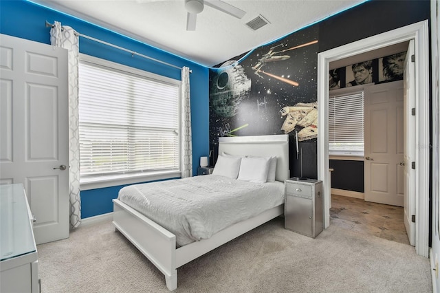 carpeted bedroom featuring ceiling fan