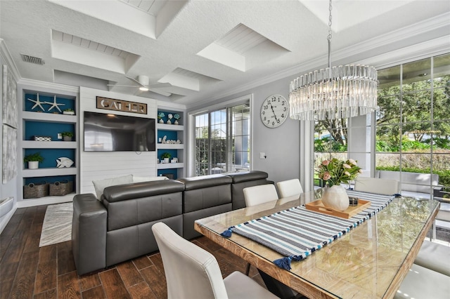 dining room with built in features, coffered ceiling, ceiling fan with notable chandelier, crown molding, and dark hardwood / wood-style flooring