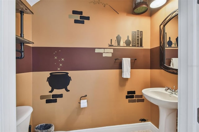 bathroom featuring sink and toilet