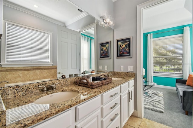 bathroom featuring crown molding, vanity, and tile patterned floors