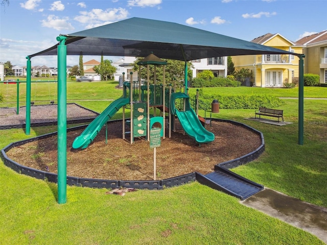 view of playground with a lawn