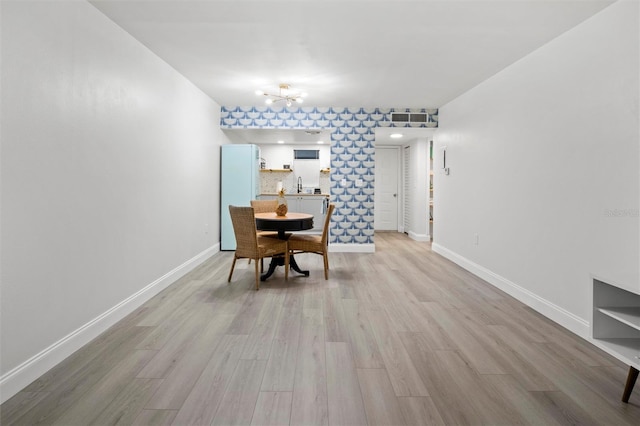 10800 US Highway 19 N Unit 112, Pinellas Park, FL 33782 - dining room with light wood-type flooring and baseboards