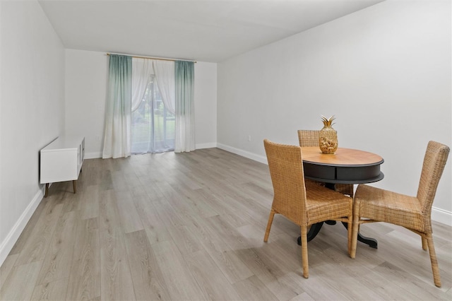 10800 US Highway 19 N Unit 112, Pinellas Park, FL 33782 - dining space with light wood-style flooring and baseboards