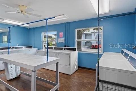 10800 US Highway 19 N Unit 112, Pinellas Park, FL 33782 - kitchen featuring washing machine and dryer, concrete floors, and a ceiling fan