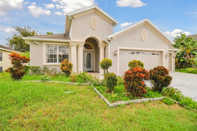 view of front facade featuring a front lawn and a garage