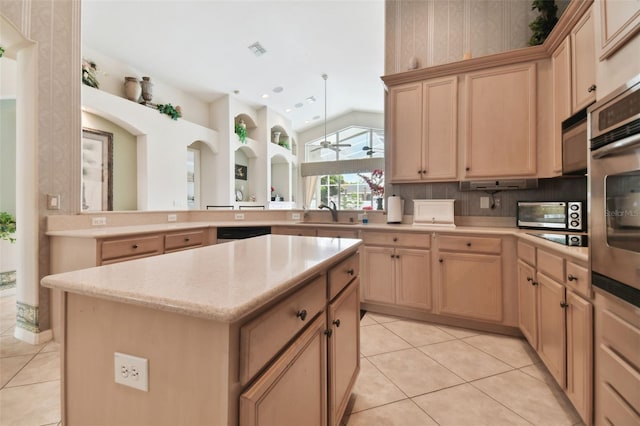 kitchen featuring light tile patterned floors, a center island, kitchen peninsula, light brown cabinets, and ceiling fan