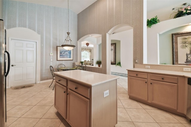 kitchen featuring pendant lighting, light tile patterned floors, and a center island