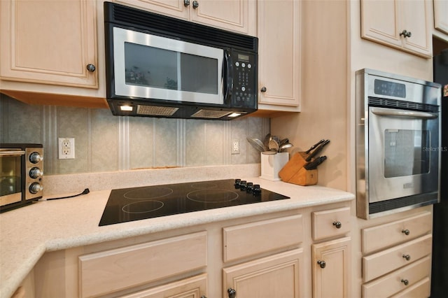 kitchen featuring light brown cabinets and stainless steel appliances