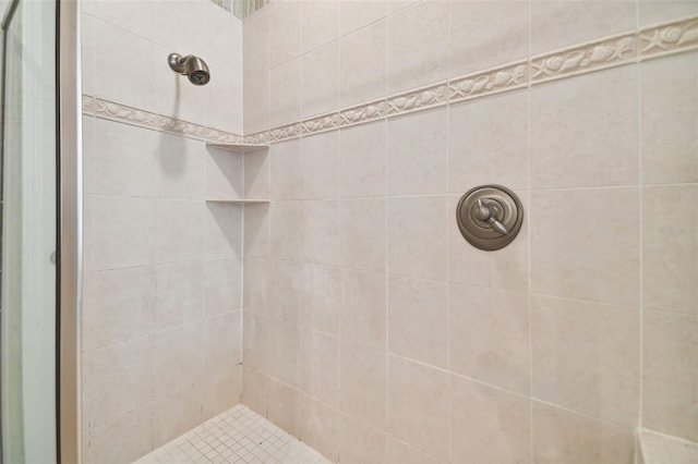 bathroom with tiled shower