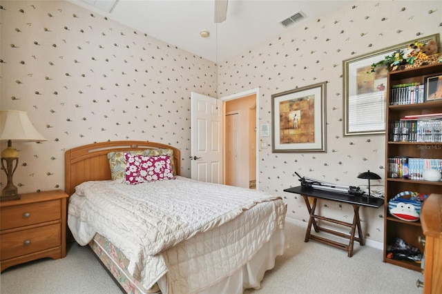 bedroom with ceiling fan and light carpet