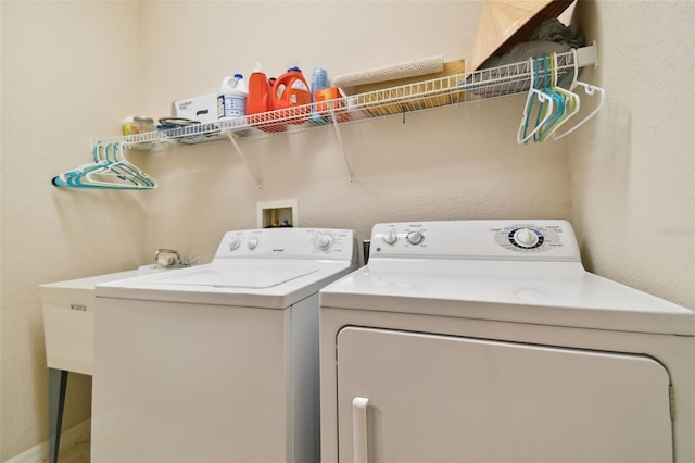 laundry room with washing machine and clothes dryer