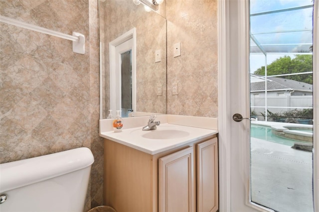 bathroom with vanity and toilet